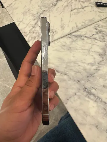 iPhone with flat stainless frame (for parts) - side view shown