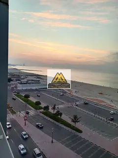 Two-bedroom apartment with a living room on the corniche, sea view, prime location, and 24-hour serv