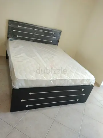 Queen size Bed with mattress.  All times delivery available