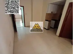 A studio for annual rent in Al Hamidiya 1 – Ajman, featuring a semi-separate kitchen and central A