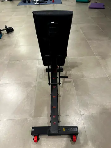 Adjustable weight bench with incline/decline settings — good condition
