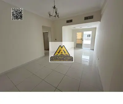 Two-bedroom apartment with hall in Al Nuaimiya 1, balcony with open view, built-in wardrobes, 2 bathrooms, central AC. 38,000 AED, 4 payments, familie