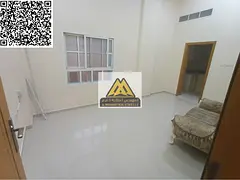 A spacious studio for annual rent in Al Rawda 2 – Ajman on Makkah Street, featuring a separate kit