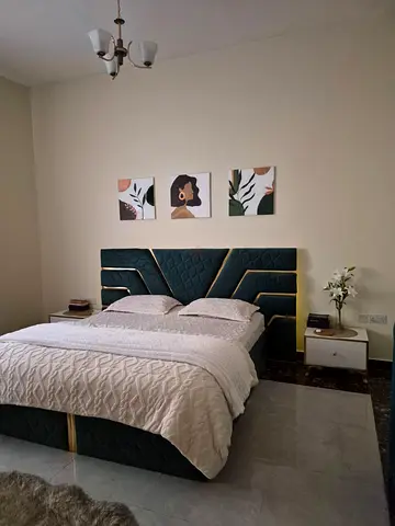 Emerald green and gold queen bed with 3 drawers side