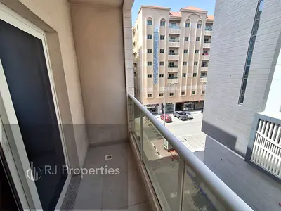 Brand new building - 1 BR apartment - balcony - coverd parking - spacious - for families