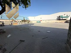 Yard in Industrial 13 10000 sqft interlock wide access main road 54KW power with office rent AED 200