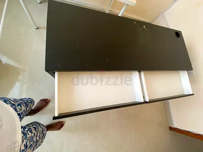 Used black office desk with two drawers