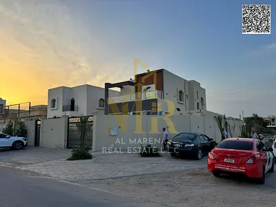 Al Muwaihat 1, a corner villa on two streets, on a plot of 5700 square feet, two floors with a roof, a majlis and a hall, a separate external annex, 5