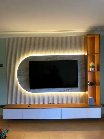 Modern wall-mounted entertainment unit with LED backlight and shelving