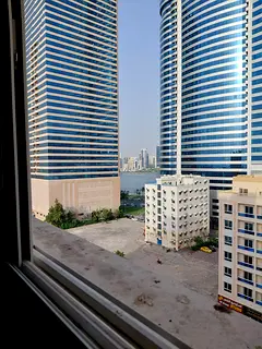 A spacious two-bedroom apartment with a living room is available for annual rent in Al Majaz 3. The