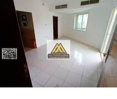 Studio in Al Rashidiya 3 with balcony, built-in wardrobes, separate kitchen, central AC. 18,000 year
