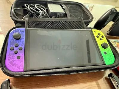 Nintendo Switch console with custom Splatoon Joy‑Con skins + case and charger