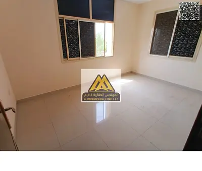 1BR apt in Al Nuaimiya 1 Ajman. Spacious, split AC. AED 24,000 yearly, 4 payments. Prime location, lowest price in Ajman, near services.