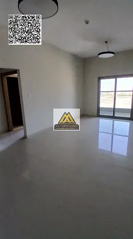 A luxury 1-bedroom apartment with a living room for annual rent in one of the finest new towers in Ajman, featuring spacious layout, master bedroom, b