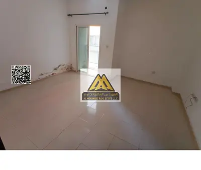 Studio in Al Nuaimiya 2, Ajman King Faisal St. Balcony, separate kitchen, central AC. AED 19,000 yearly, 4 payments, free maintenance.