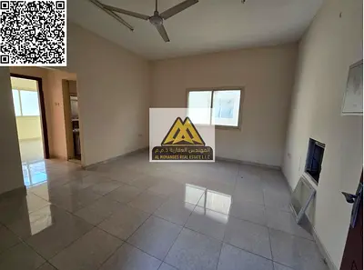 A 1-bedroom apartment with a living room for annual rent in Al Alia – Ajman, featuring a spacious layout, split AC, and a balcony, located in a quiet