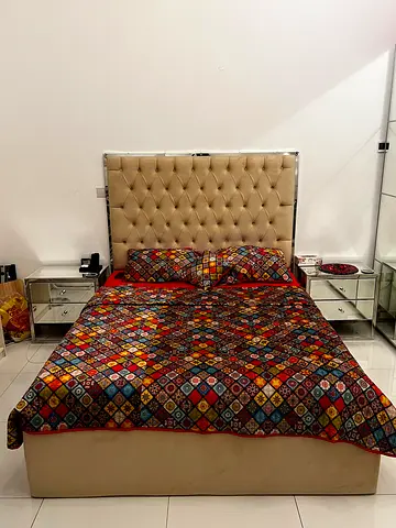 King size bed with tufted headboard and without mattress. (Mattress sold separately)