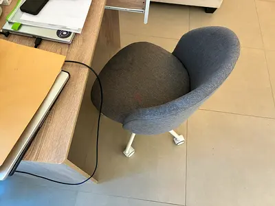 Compact Grey Upholstered Office Chair with Castor Wheels