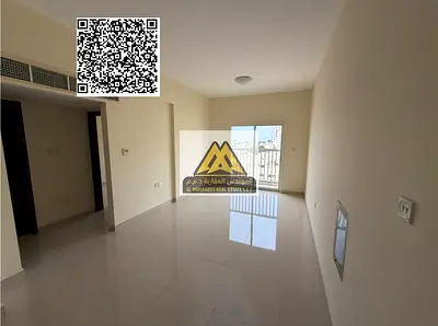A 1-bedroom apartment with a living room for annual rent in Al Nuaimiya 3 – Ajman. It features spacious interiors, a balcony, and central AC, located