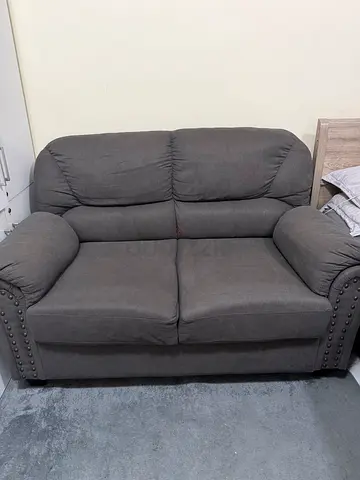 Grey Fabric Sofa with Studded Arms – Good Condition
