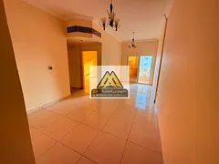 For Annual Rent – Ajman, Al Nuaimiya 2Two-bedroom apartment with living room, 2 bathrooms, and a b