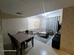 Luxuriously furnished two-bedroom apartment with a living room and private parking.