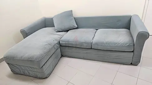 Light grey L-shaped 3-seater sofa with chaise, good used condition.