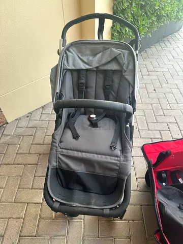 Bugaboos stroller with travel bag and rear seat. Bassinet and chair.