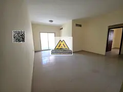 Two-bedroom apartment with hall in Al Nuaimiya 2, large space, balcony, 2 bathrooms, central AC. 32,