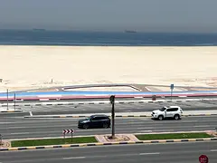 Two-bedroom apartment with a living room for annual rent on a sharing basis in Ajman Corniche, with
