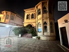 Villa for sale in Ajman, Al Rawda area. 5 master bedrooms, living room, majlis, and maid's room.