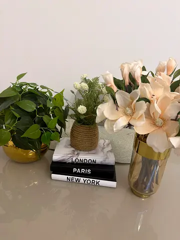 Set of decorative faux plants and coffee table books - modern centerpiece