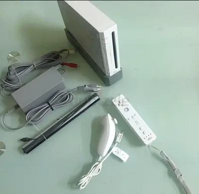 Nintendo Wii console with Wii Remote, Nunchuk, sensor bar and power cables - good condition