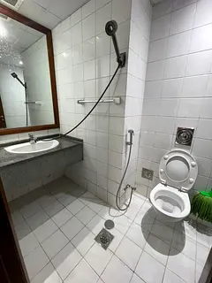 Regular room with private wash room for rent near Electra ADCB