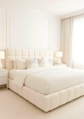 King-size upholstered bed frame with padded headboard