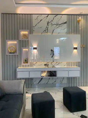Modern Wall-Mounted Entertainment Unit with LED Shelves and Marble Backing