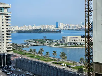 Free AC gym and pool three bedrooms and living room with maid room built in wardrobes prime location on Khalid Lagoon Corniche