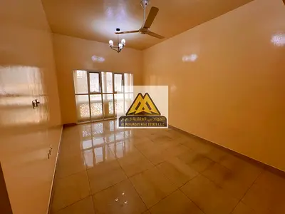 One-Bedroom Apartment with Separate Hall for Annual Rent in Al Mowaihat 3 Ajman – Central AC and Spacious Layout