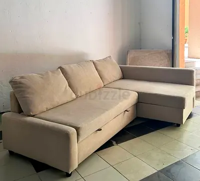 Beige L-shaped Sofa Bed with Storage — Good Condition
