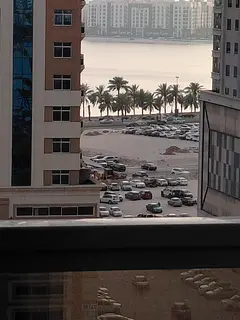 A spacious two-bedroom apartment with a living room is available for annual rent in Al Majaz 3. The