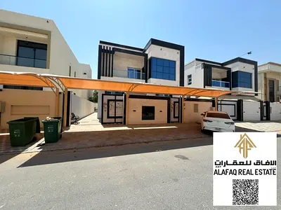 Villa for rent in Al Yasmeen with five bedrooms, a living hall, majlis, maid’s room, six bathrooms, modern finishing, prime location, AED 95,000 yearl
