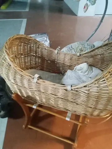 Wicker baby bassinet with wooden stand - gently used