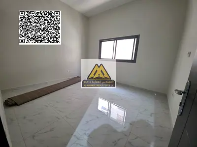 A spacious studio for annual rent in Al Jurf Industrial 3 – Ajman, featuring a separate kitchen for better privacy, central air conditioning, and good