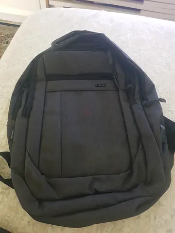Dark grey laptop backpack — used, good condition