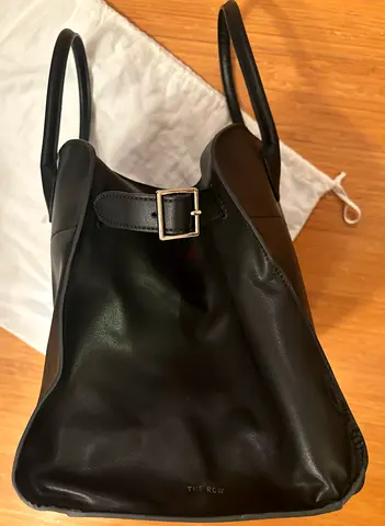 Black leather tote bag with buckle detail - gently used