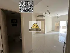 A 2-bedroom apartment with a living room for annual rent in Al Nuaimiya 1 – Ajman, featuring 2 bat
