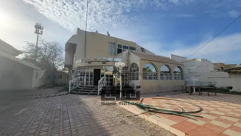 Villa for sale in Al Azra Sharjah large land spacious layout family friendly quiet location