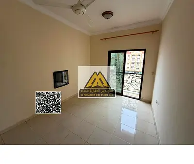 One-bedroom apartment with a living room in Al Hamidiya 1, Ajman. Two balconies, central AC, spacious layout, prime location near Ajman University, AE