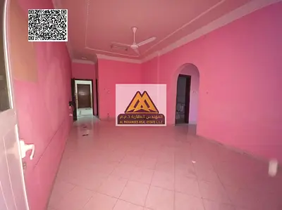 Two-bedroom apartment for rent in Ajman Industrial Area, directly on the street, with a balcony offering an open view, comfortable space, and a vibran