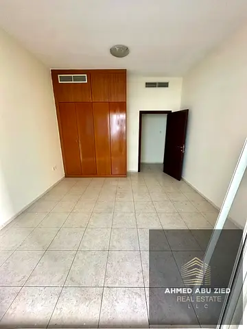 2-bedroom apartment for rent in Al Taawun Sharjah near Al Taawun Roundabout, great location, 2 bathrooms, wardrobes, AC included, gym and pool.